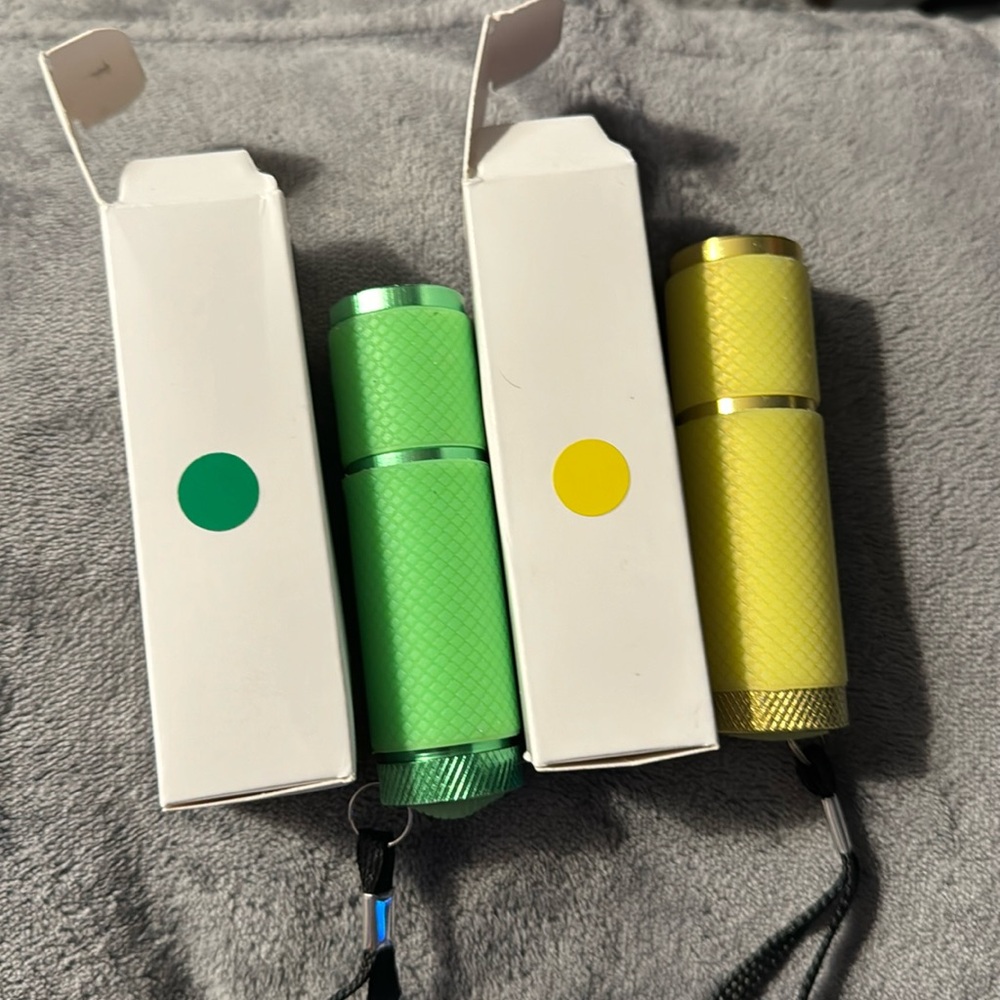 Set of two NEW small (one yellow one green) super bright LED flashlights
